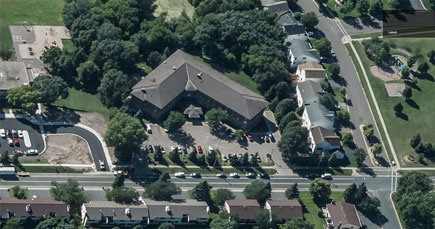 Aerial photo of apartment complexes, roads, and houses