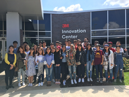 international students in front of 3M innovation center