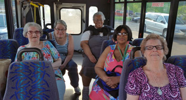 Older adult women on a bus