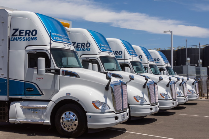 Zero-emissions semi trucks parked in a row