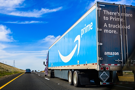 Amazon semi truck driving down a two-lane paved road