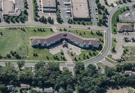 Aerial photo of apartment complexes, roads, and streets