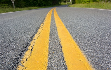 Close up of a paved road in a rural area