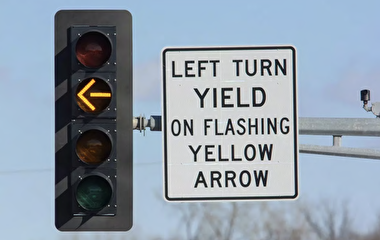 Traffic signal with flashing yellow arrow